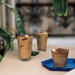 Duralex Prisme Iced Coffee Cup (Set of 6) Duralex Prisme. Clear tall glass with elegant embossed check pattern. Un verre transparent haut avec un élégant motif en relief à carreaux.